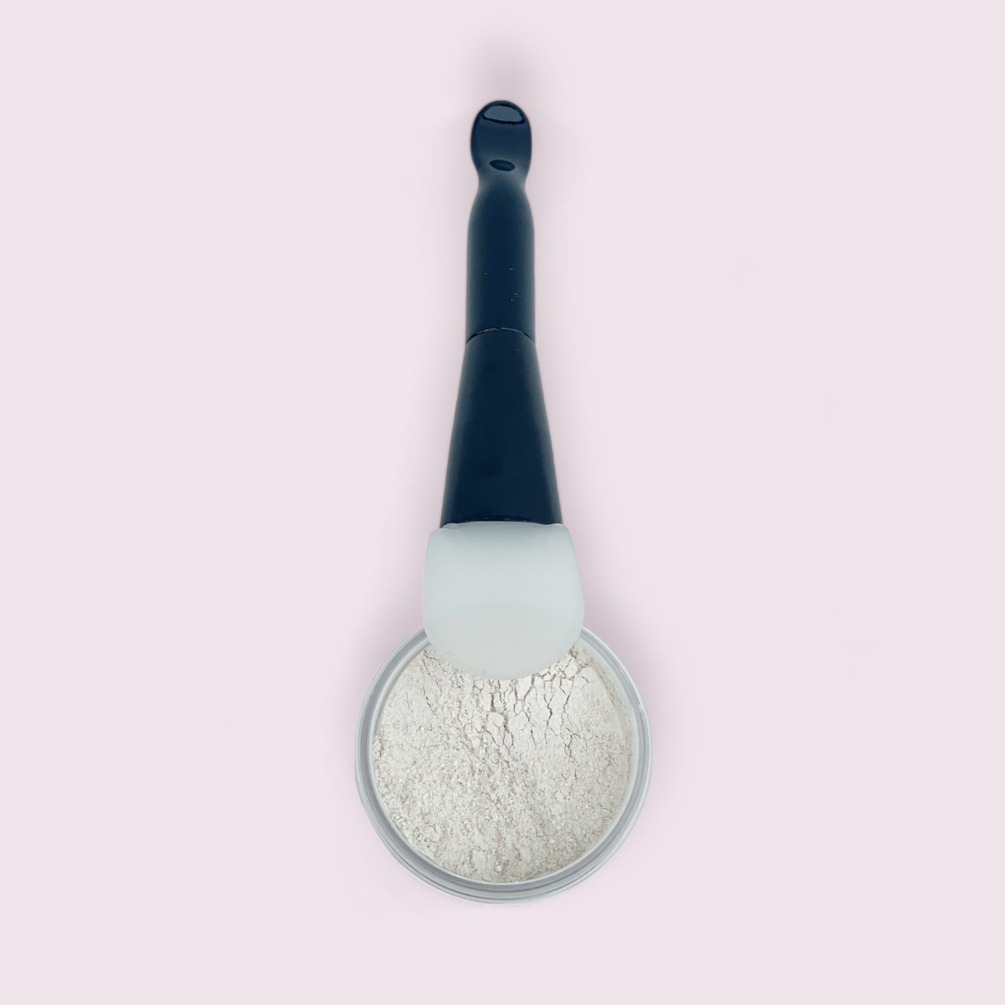 open jar of the whisper calming face mask and cleanser with mask brush