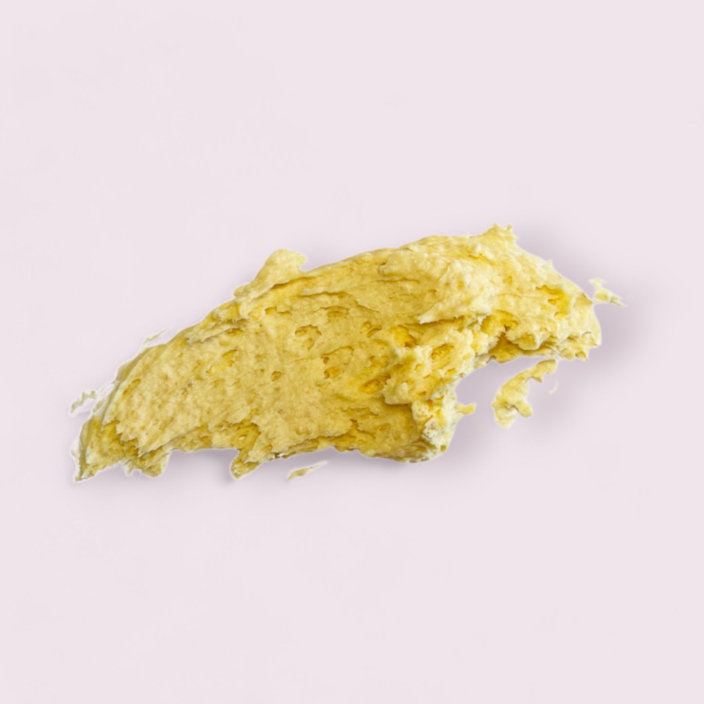 smear of thankful body polish showing texture of the product