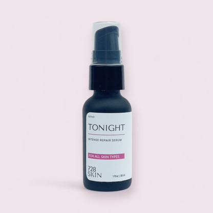 bottle of tonight intense repair facial serum