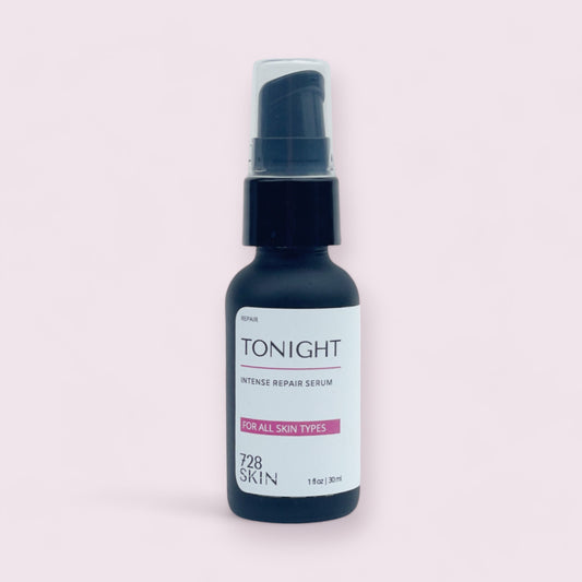 bottle of tonight intense repair facial serum